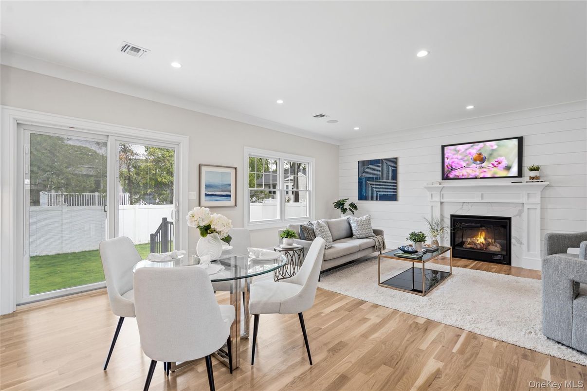 Dining room, Fireplace, Interior, Living room, Recessed Lighting, Wood Texture Flooring