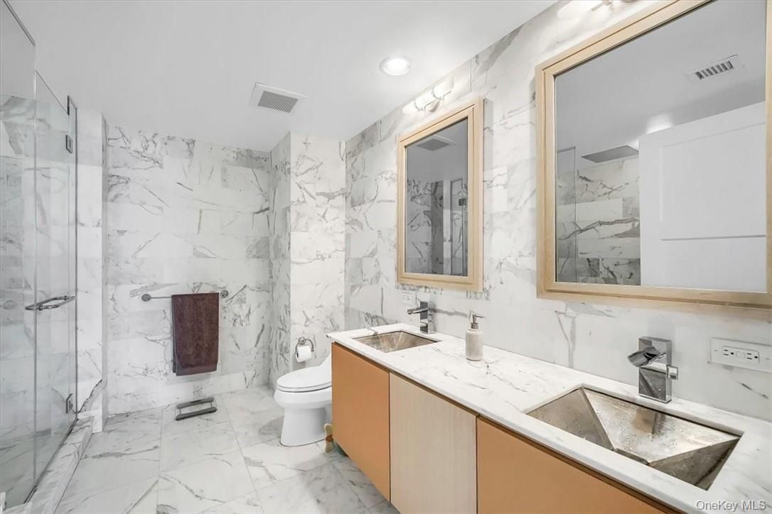 Bathroom, Dual Sink Vanities, Glass Shower, Interior, Marble, Marble Walls, Recessed Lighting