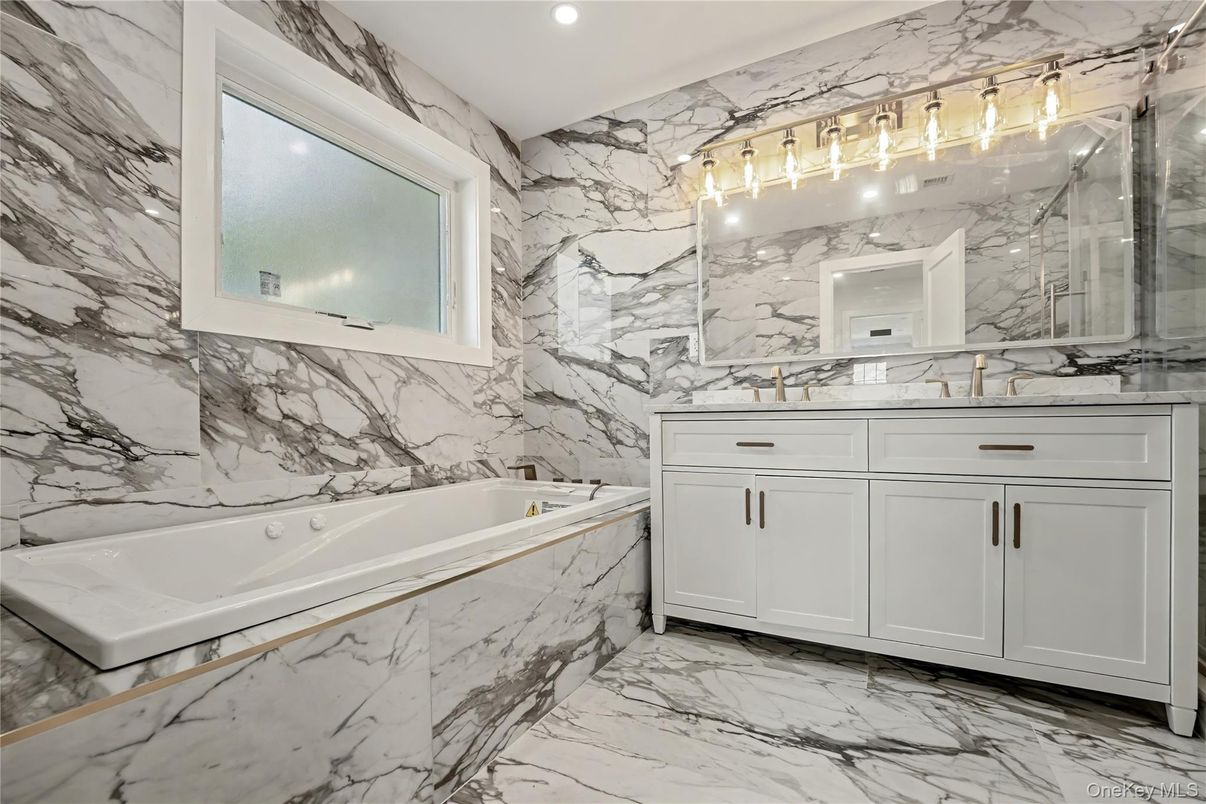 Bathroom, Dual Sink Vanities, Interior, Marble, Marble Walls, Recessed Lighting