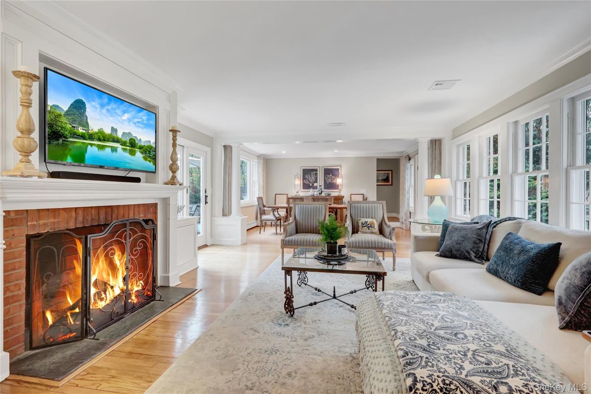 Dining room, Fireplace, Interior, Living room, Recessed Lighting, Wood Texture Flooring