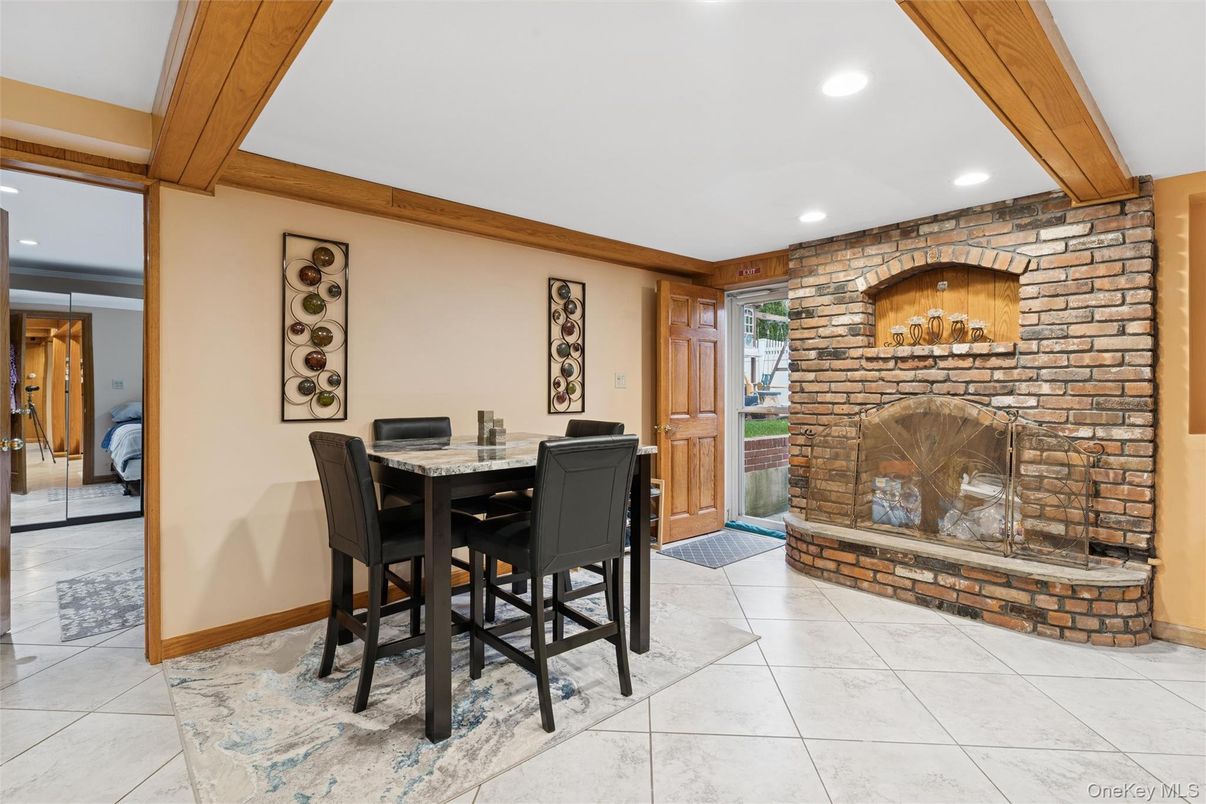 Dining room, Fireplace, Interior, Recessed Lighting, Stone Walls, Wooden Beams