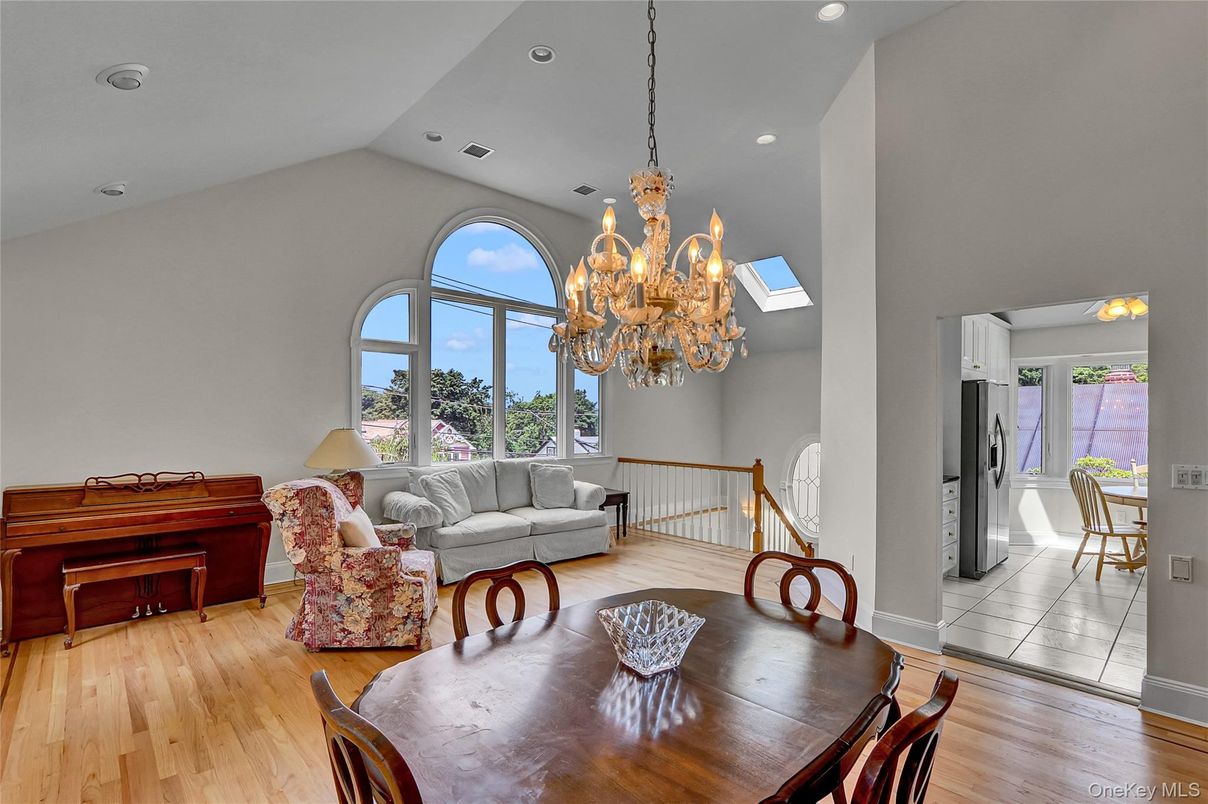Chandelier, Dining room, Interior, Living room, Piano, Recessed Lighting, Wood Texture Flooring