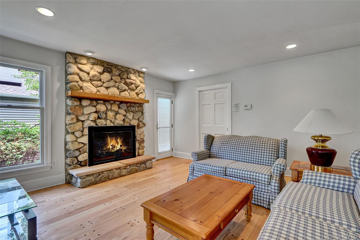 Fireplace, Interior, Living room, Recessed Lighting, Stone Walls, Wood Texture Flooring