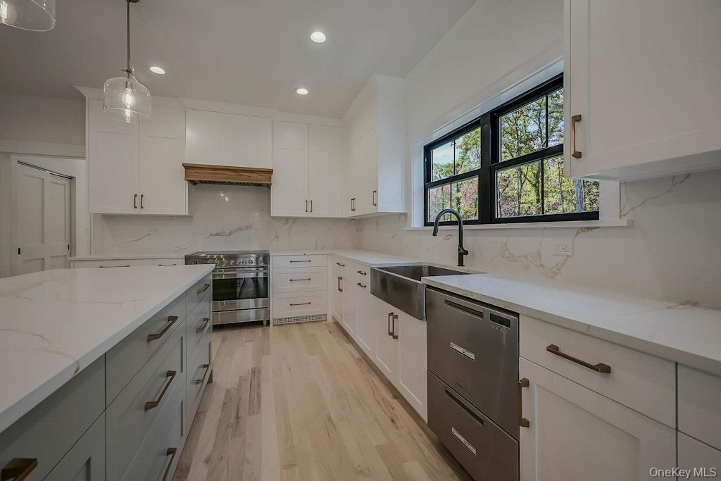 Interior, Kitchen, Marble Walls, Pendant Lights, Recessed Lighting, Stainless Steel Appliances, Wood Texture Flooring