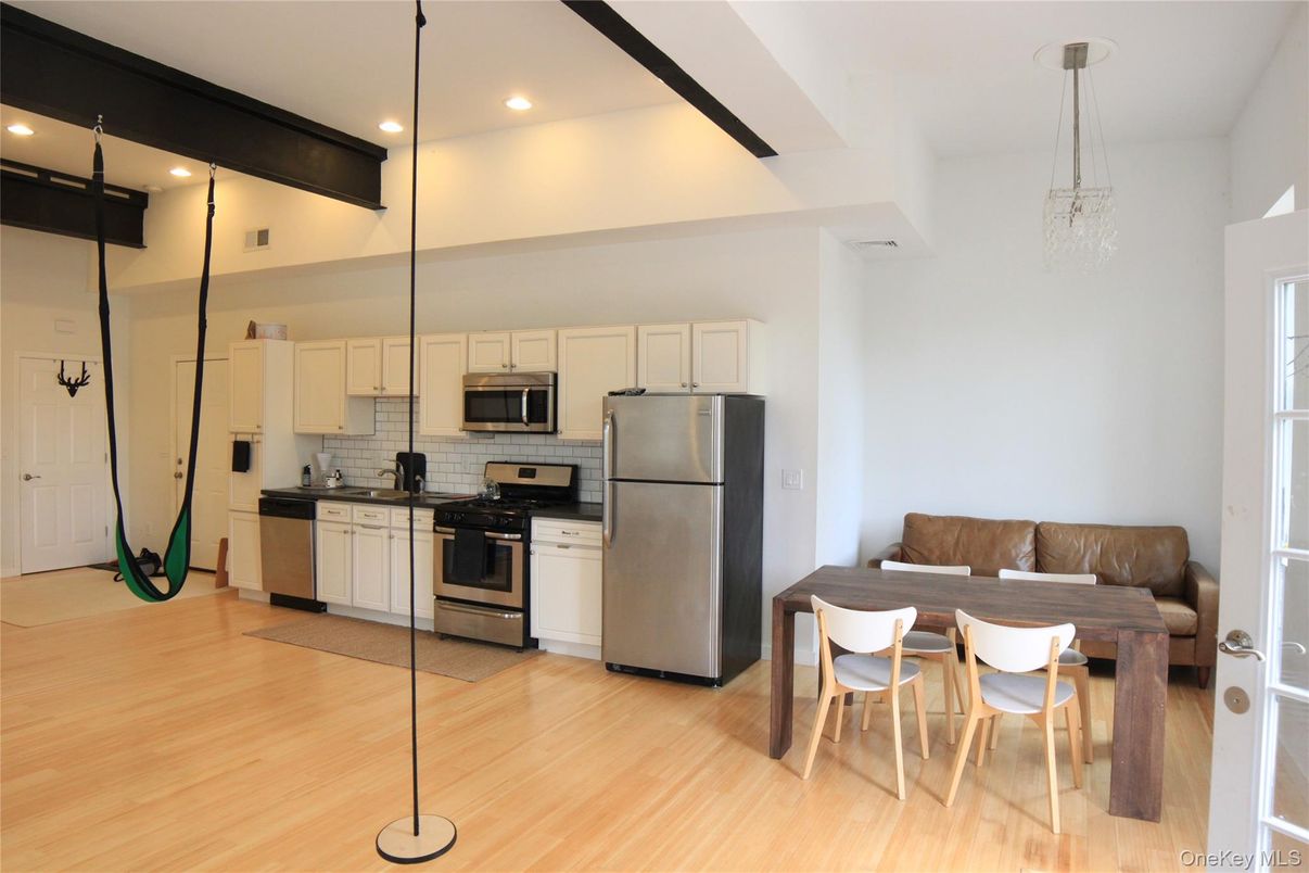 Dining room, Interior, Kitchen, Pendant Lights, Recessed Lighting, Stainless Steel Appliances, Wood Texture Flooring