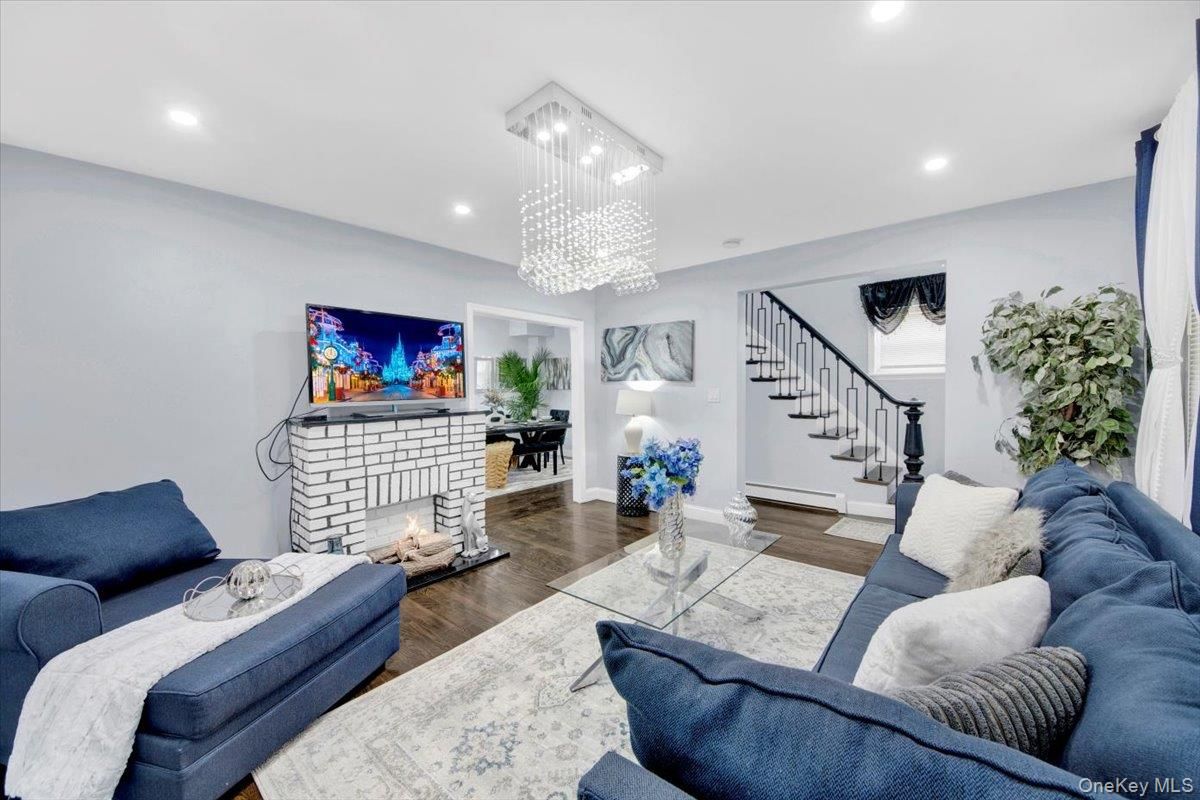 Chandelier, Fireplace, Interior, Living room, Recessed Lighting, Wood Texture Flooring