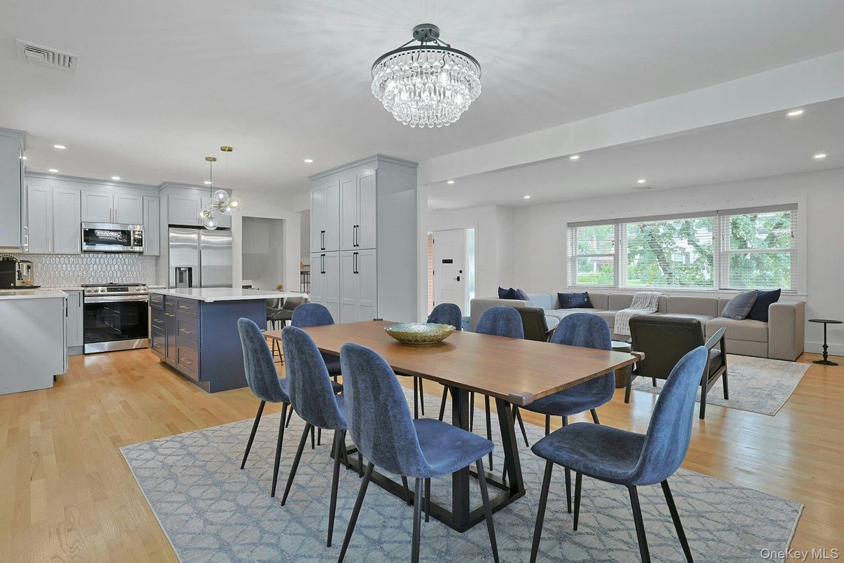 Chandelier, Dining room, Interior, Kitchen, Living room, Pendant Lights, Recessed Lighting, Stainless Steel Appliances, Wood Texture Flooring