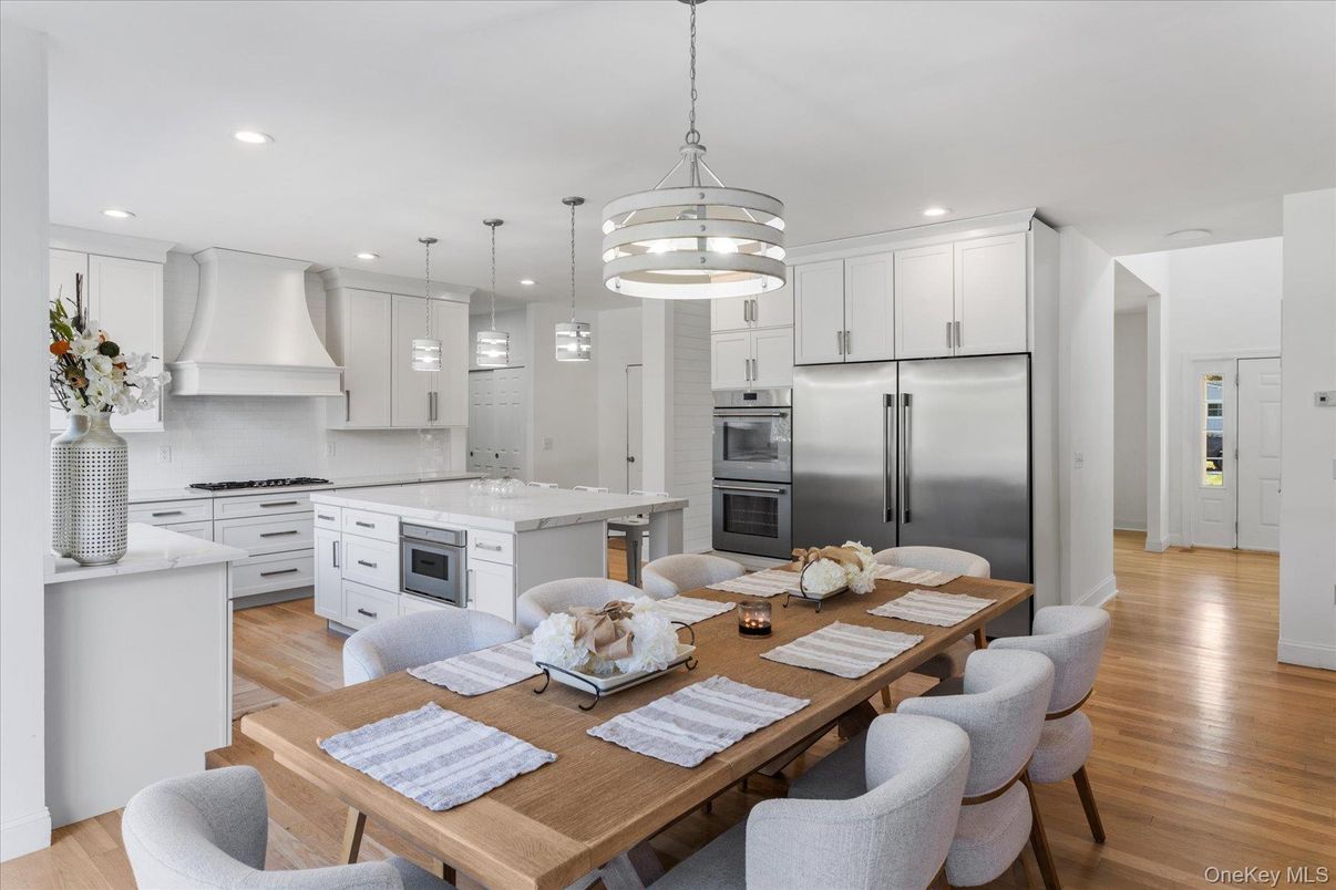 Dining room, Interior, Kitchen, Pendant Lights, Recessed Lighting, Stainless Steel Appliances, Wood Texture Flooring