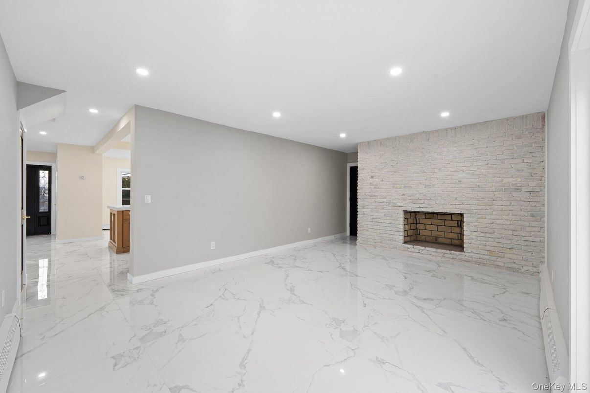 Empty room, Fireplace, Interior, Marble, Recessed Lighting, Stone Walls