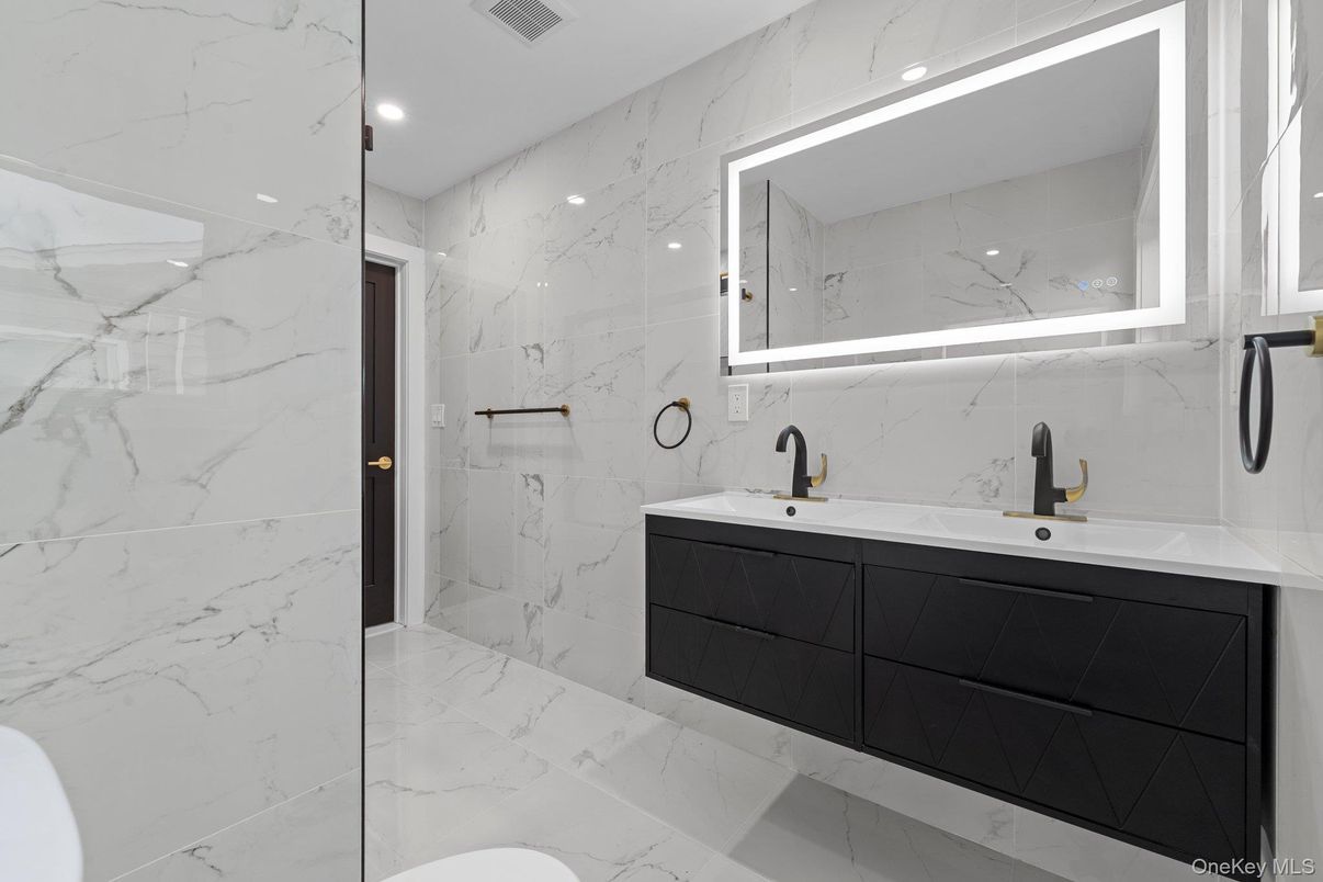 Bathroom, Dual Sink Vanities, Glass Shower, Interior, Marble, Marble Walls, Recessed Lighting