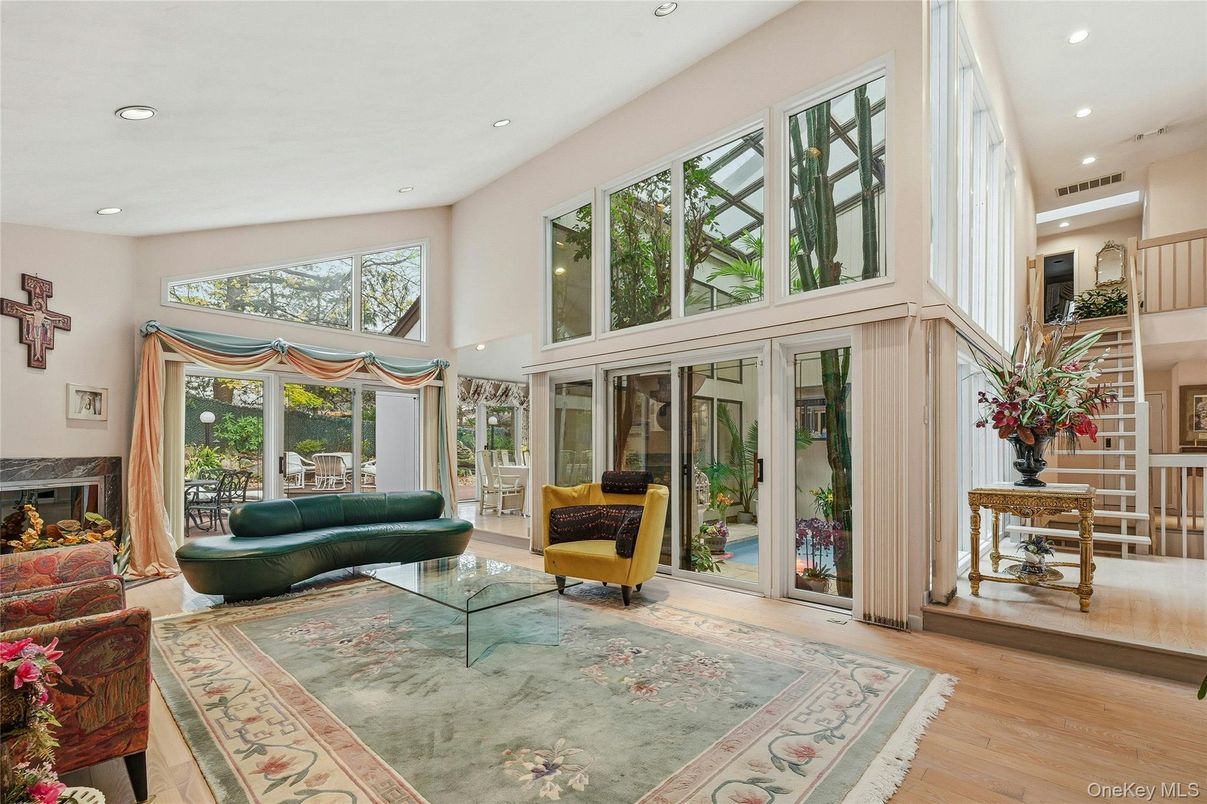 Fireplace, Interior, Living room, Recessed Lighting, Sun Room, Wood Texture Flooring