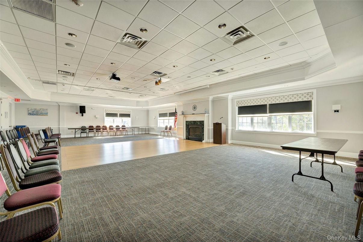 Fireplace, Game Room, Interior, Pendant Lights, Recessed Lighting, Wood Texture Flooring