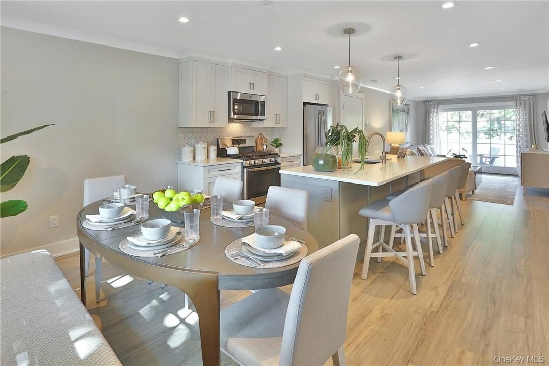 Dining room, Interior, Kitchen, Pendant Lights, Recessed Lighting, Stainless Steel Appliances, Wood Texture Flooring