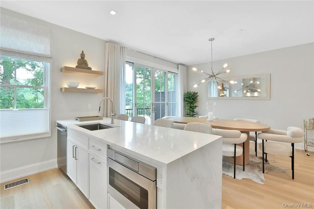 Dining room, Interior, Kitchen, Pendant Lights, Recessed Lighting, Stainless Steel Appliances, Wood Texture Flooring