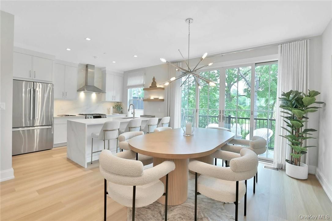 Dining room, Interior, Kitchen, Pendant Lights, Recessed Lighting, Stainless Steel Appliances, Wood Texture Flooring