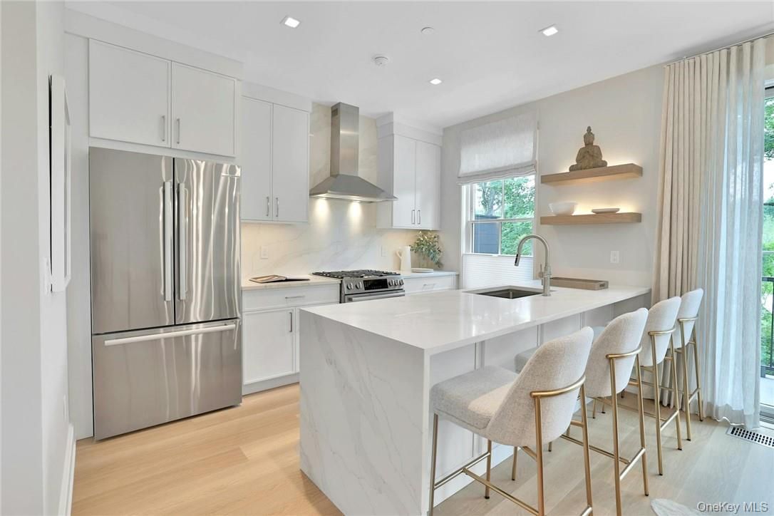 Interior, Kitchen, Marble Walls, Recessed Lighting, Stainless Steel Appliances, Wood Texture Flooring