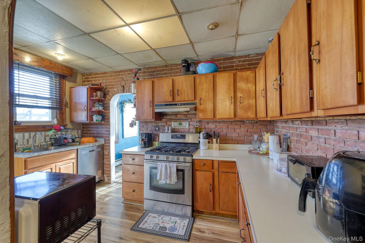 Interior, Kitchen, Stainless Steel Appliances, Stone Walls, Wood Texture Flooring