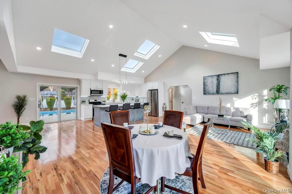 Dining room, Interior, Kitchen, Living room, Pendant Lights, Recessed Lighting, Stainless Steel Appliances, Wood Texture Flooring