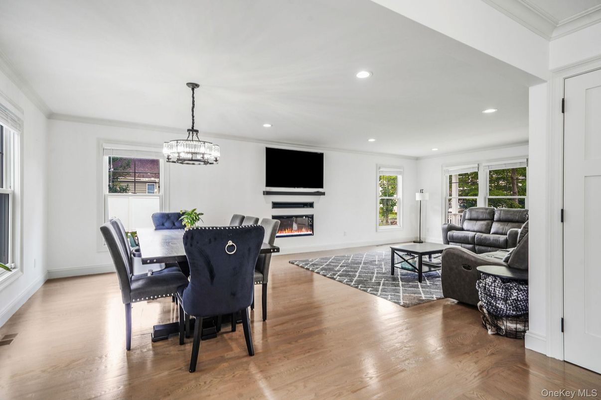 Dining room, Fireplace, Interior, Living room, Pendant Lights, Recessed Lighting, Wood Texture Flooring