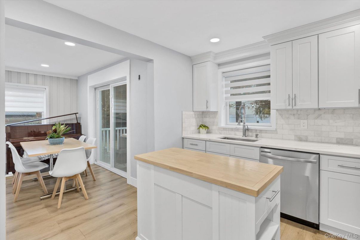 Dining room, Interior, Kitchen, Recessed Lighting, Stainless Steel Appliances, Wood Texture Flooring