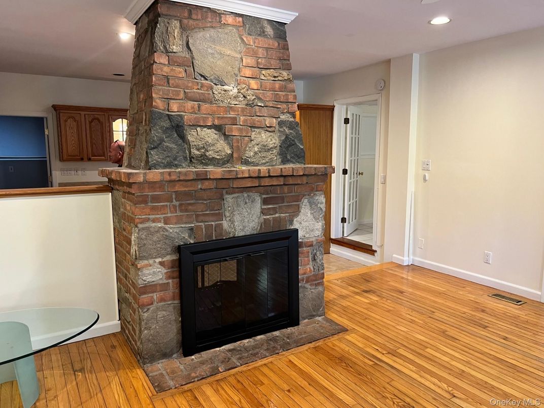 Fireplace, Interior, Recessed Lighting, Stone Walls, Wood Texture Flooring