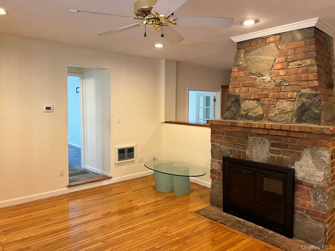 Fireplace, Interior, Recessed Lighting, Stone Walls, Wood Texture Flooring