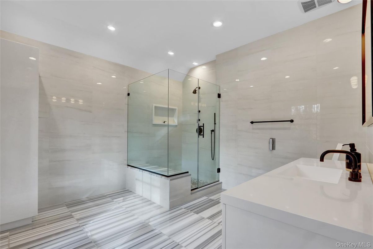 Bathroom, Dual Sink Vanities, Glass Shower, Interior, Marble Walls, Recessed Lighting
