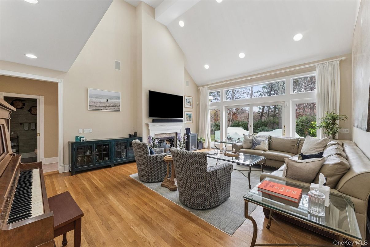 Fireplace, Interior, Living room, Piano, Recessed Lighting, Wood Texture Flooring