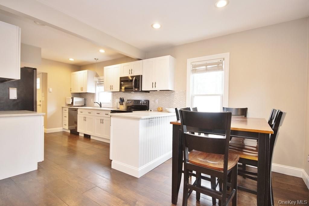 Dining room, Interior, Kitchen, Recessed Lighting, Stainless Steel Appliances, Wood Texture Flooring