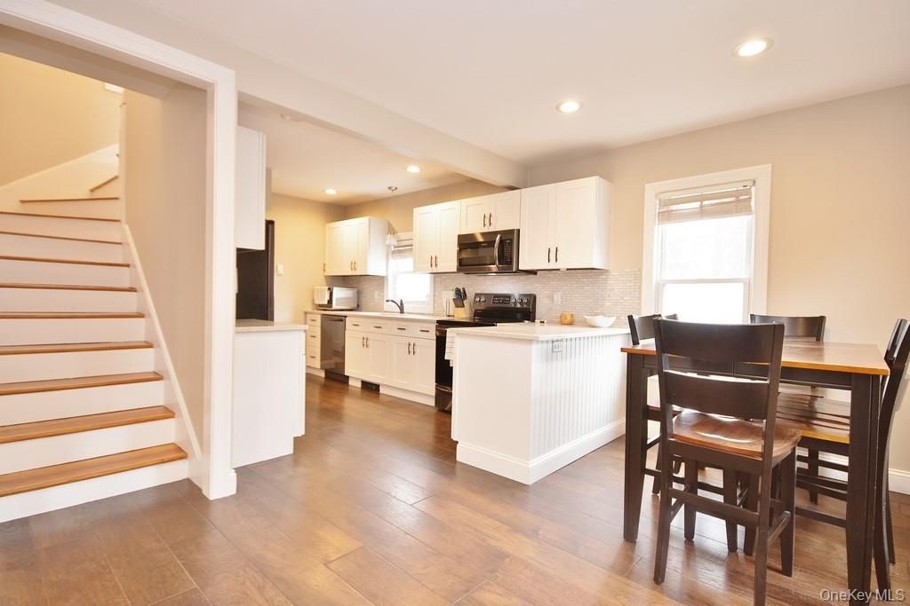 Dining room, Interior, Kitchen, Recessed Lighting, Stainless Steel Appliances, Wood Texture Flooring