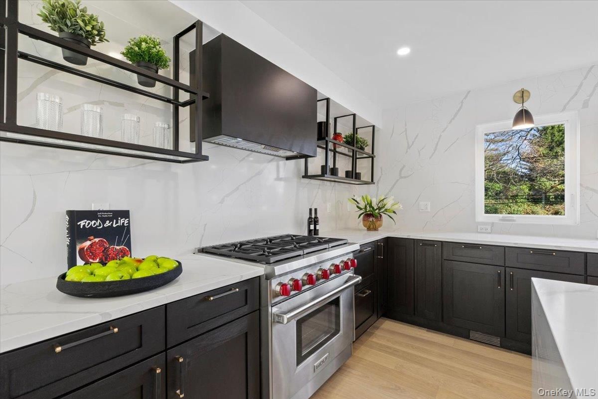 Interior, Kitchen, Marble Walls, Recessed Lighting, Stainless Steel Appliances, Wood Texture Flooring