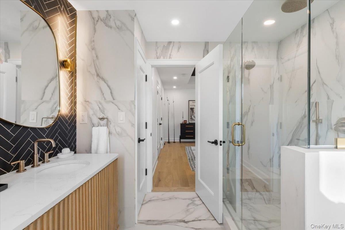 Bathroom, Glass Shower, Interior, Marble, Marble Walls, Recessed Lighting, Wood Texture Flooring