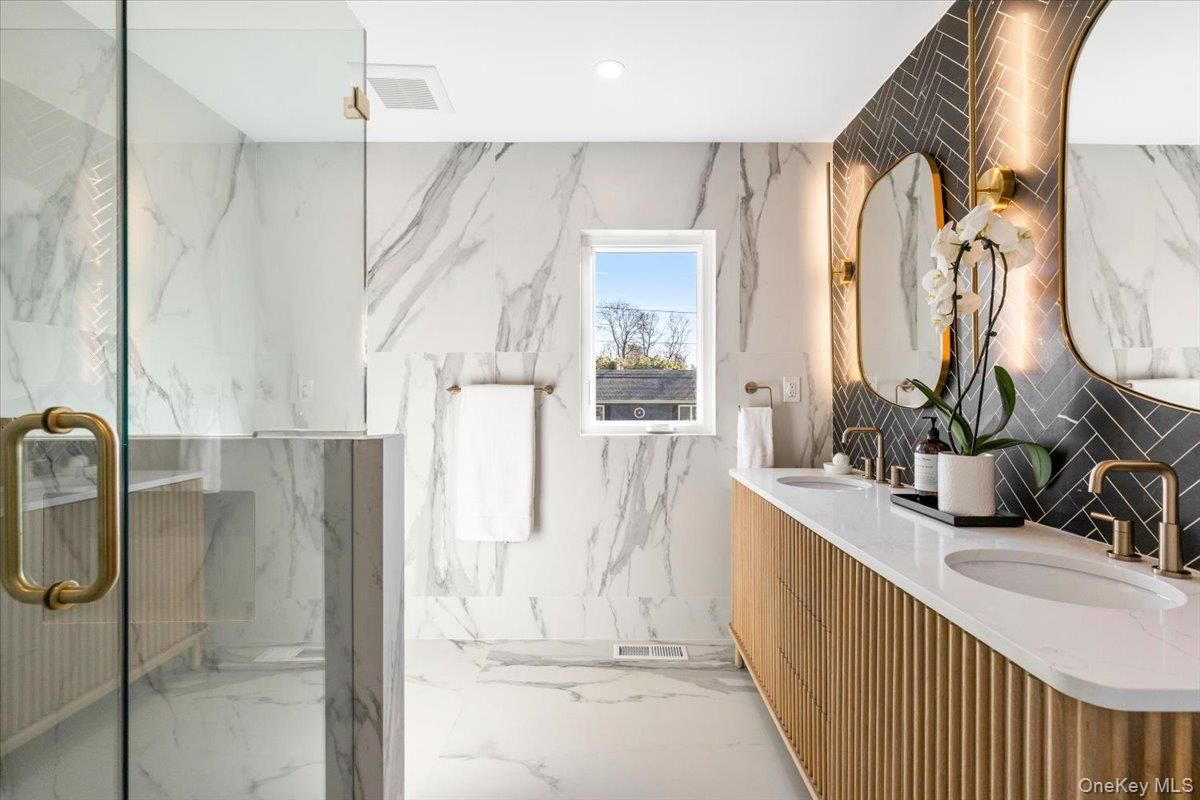 Bathroom, Dual Sink Vanities, Glass Shower, Interior, Marble, Marble Walls, Recessed Lighting