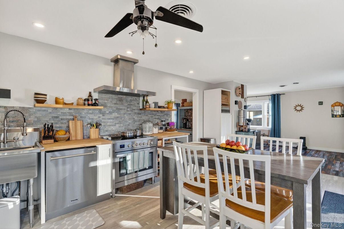 Dining room, Interior, Kitchen, Recessed Lighting, Stainless Steel Appliances, Wood Texture Flooring