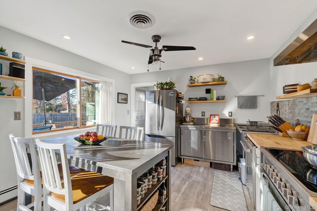 Dining room, Interior, Kitchen, Recessed Lighting, Stainless Steel Appliances, Wood Texture Flooring