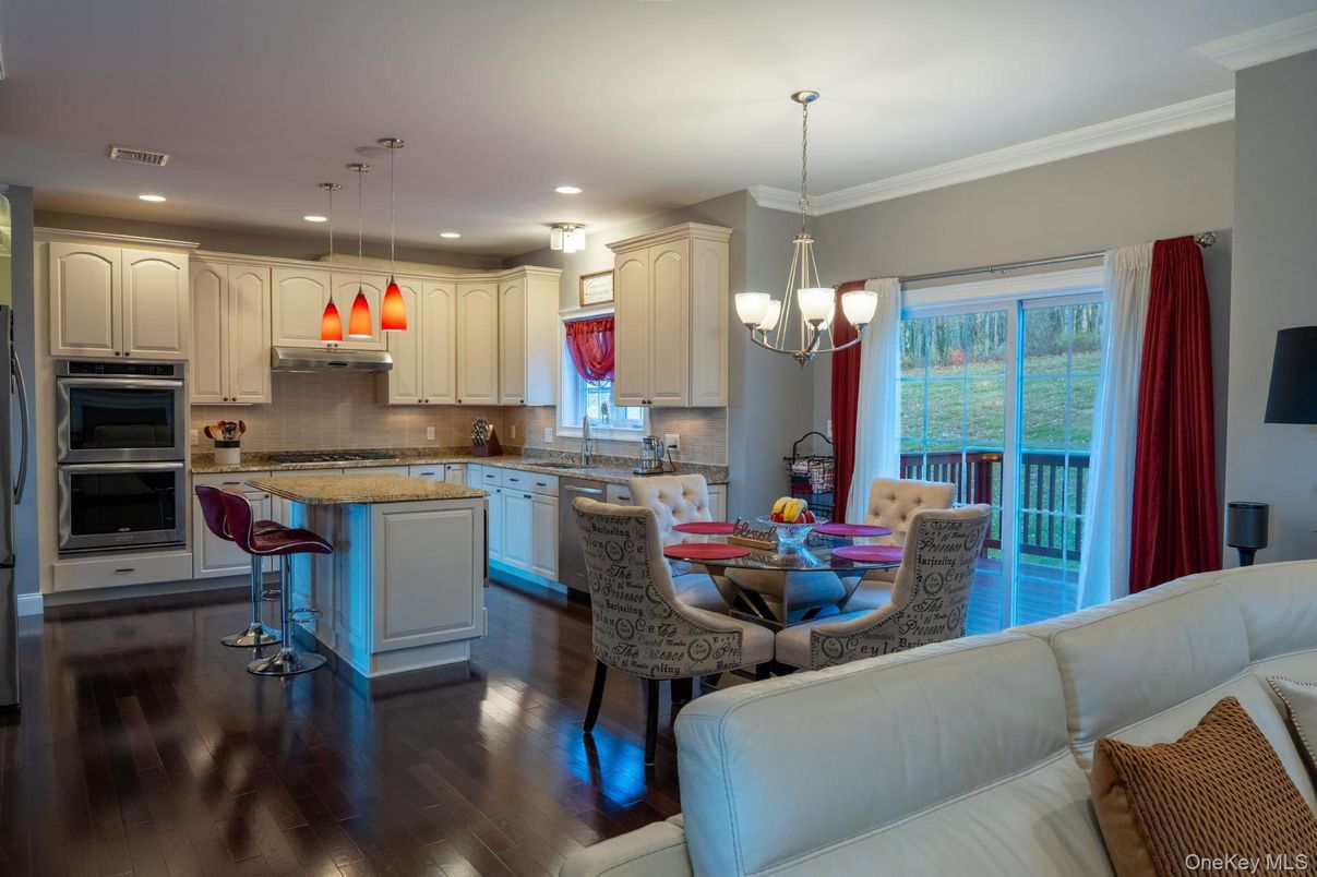 Chandelier, Dining room, Interior, Kitchen, Pendant Lights, Recessed Lighting, Stainless Steel Appliances, Wood Texture Flooring