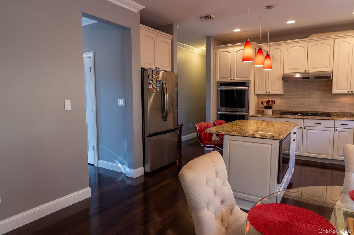 Dining room, Interior, Kitchen, Pendant Lights, Recessed Lighting, Stainless Steel Appliances, Wood Texture Flooring
