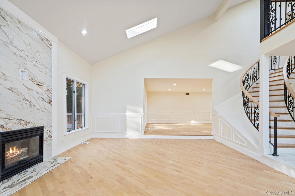 Fireplace, Interior, Marble Walls, Recessed Lighting, Wood Texture Flooring