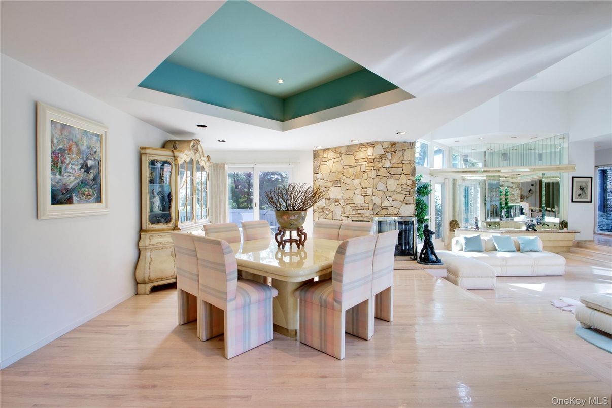 Dining room, Fireplace, Interior, Living room, Recessed Lighting, Stone Walls, Wood Texture Flooring