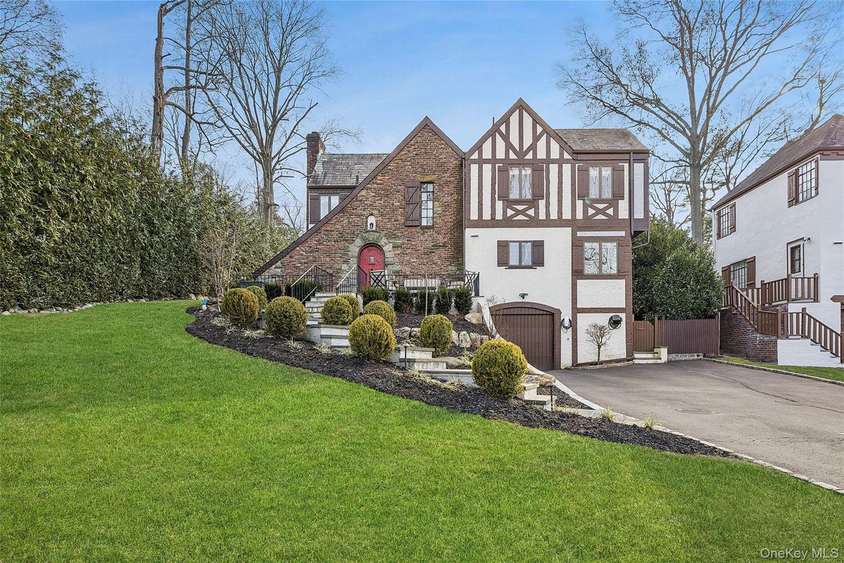 Attached, Backyard, Exterior, Facade, Brick Facade, Tudor Revival