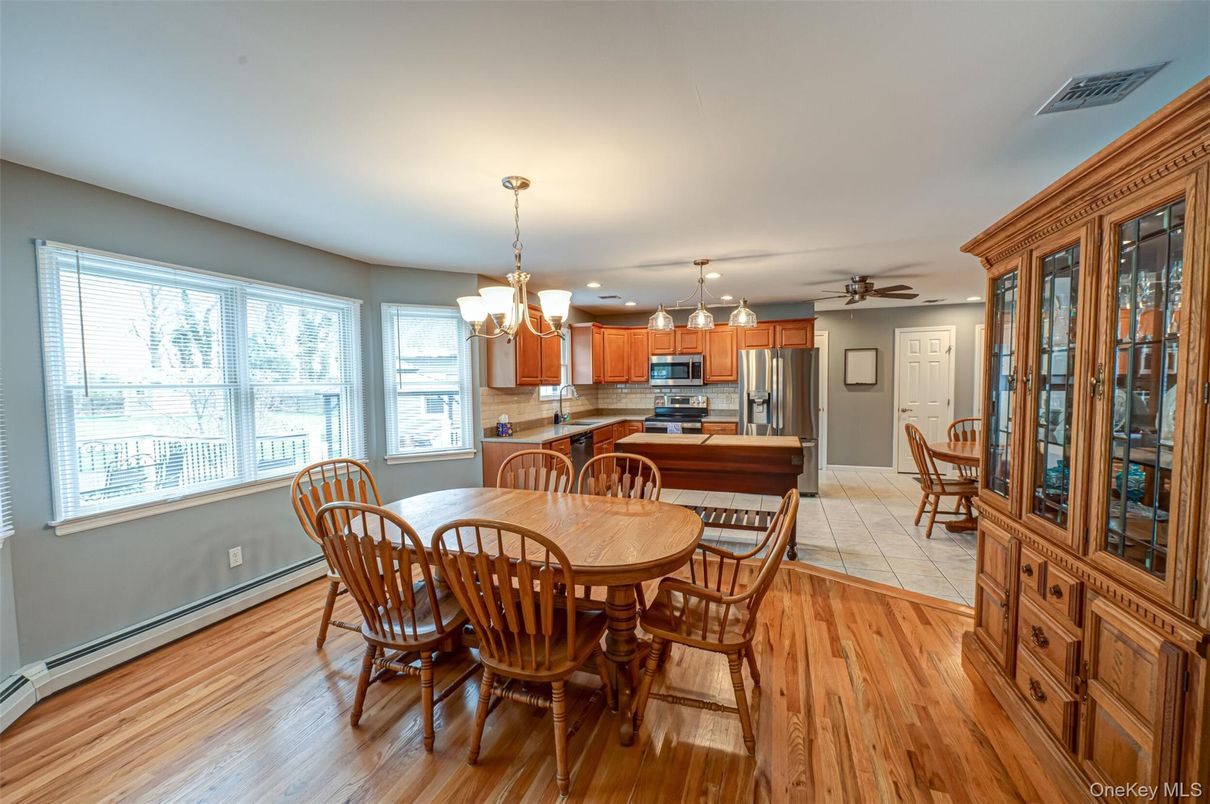 Chandelier, Dining room, Interior, Kitchen, Recessed Lighting, Stainless Steel Appliances, Wood Texture Flooring