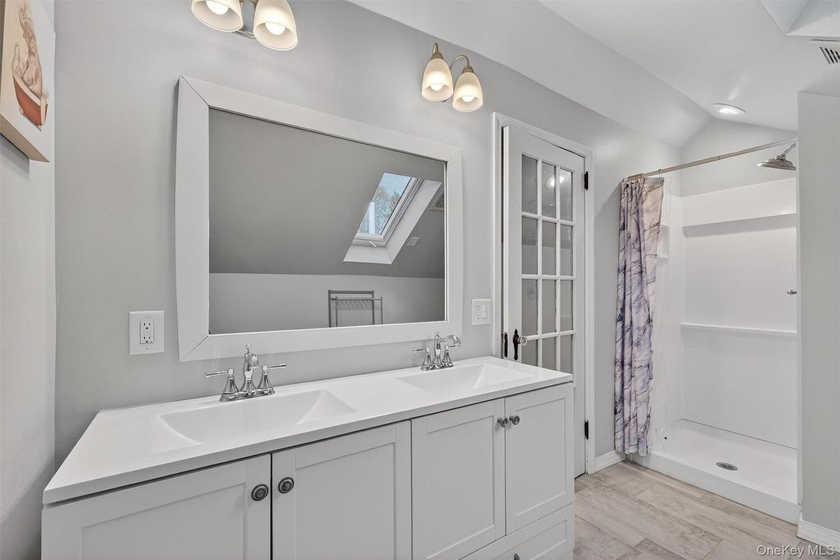 Bathroom, Dual Sink Vanities, Interior, Recessed Lighting, Wood Texture Flooring