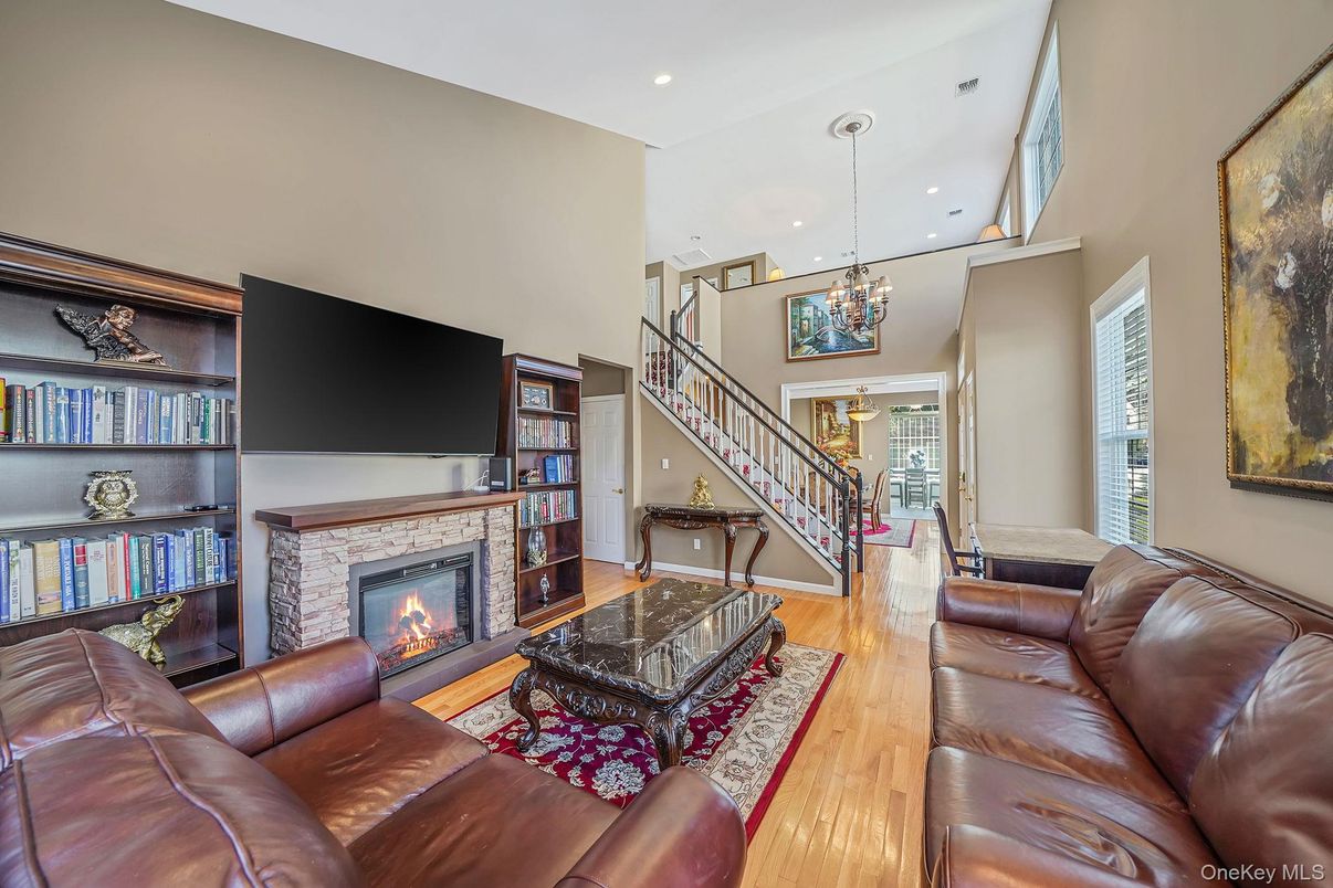 Chandelier, Fireplace, Interior, Living room, Pendant Lights, Recessed Lighting, Wood Texture Flooring