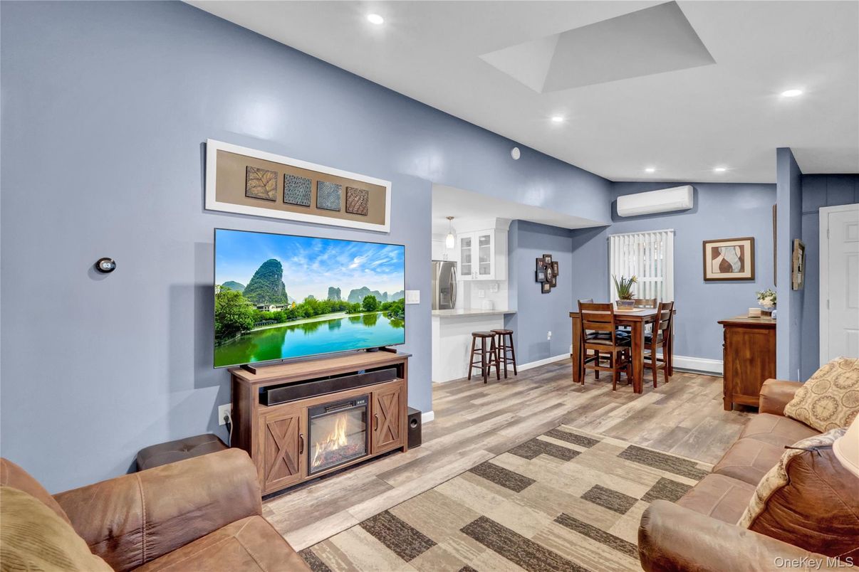 Dining room, Fireplace, Interior, Living room, Pendant Lights, Recessed Lighting, Wood Texture Flooring