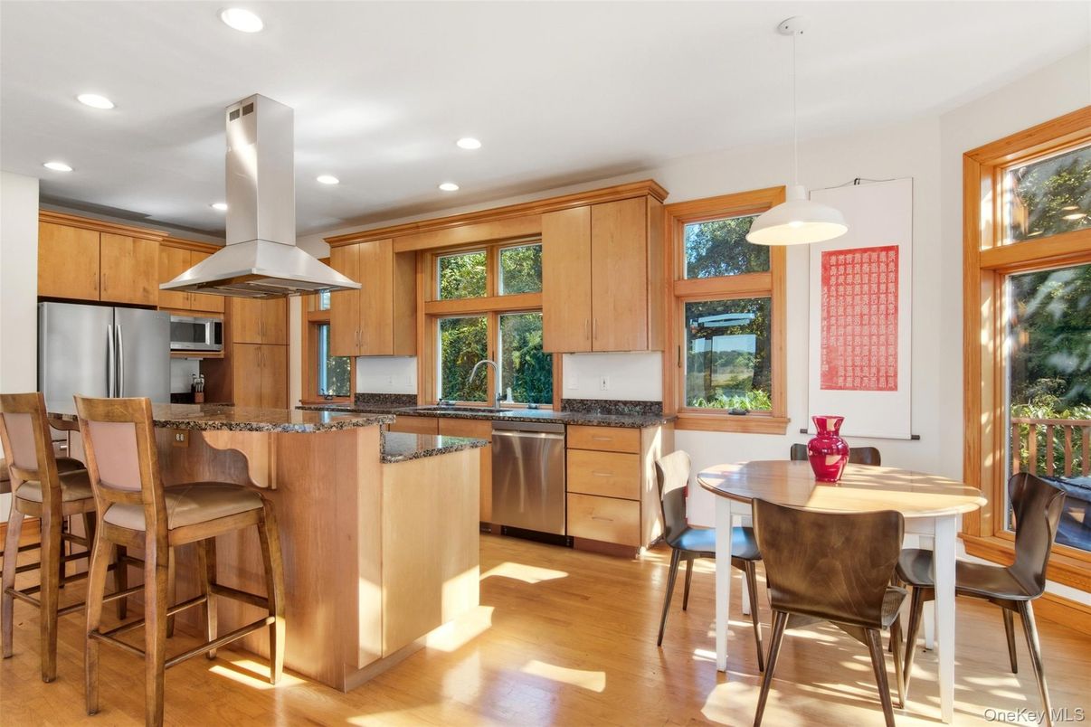 Dining room, Interior, Kitchen, Pendant Lights, Recessed Lighting, Stainless Steel Appliances, Wood Texture Flooring