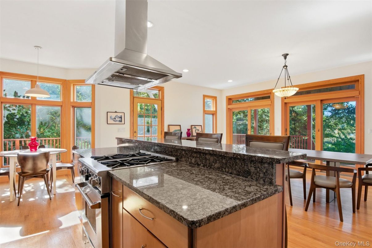 Dining room, Interior, Kitchen, Pendant Lights, Recessed Lighting, Stainless Steel Appliances, Wood Texture Flooring