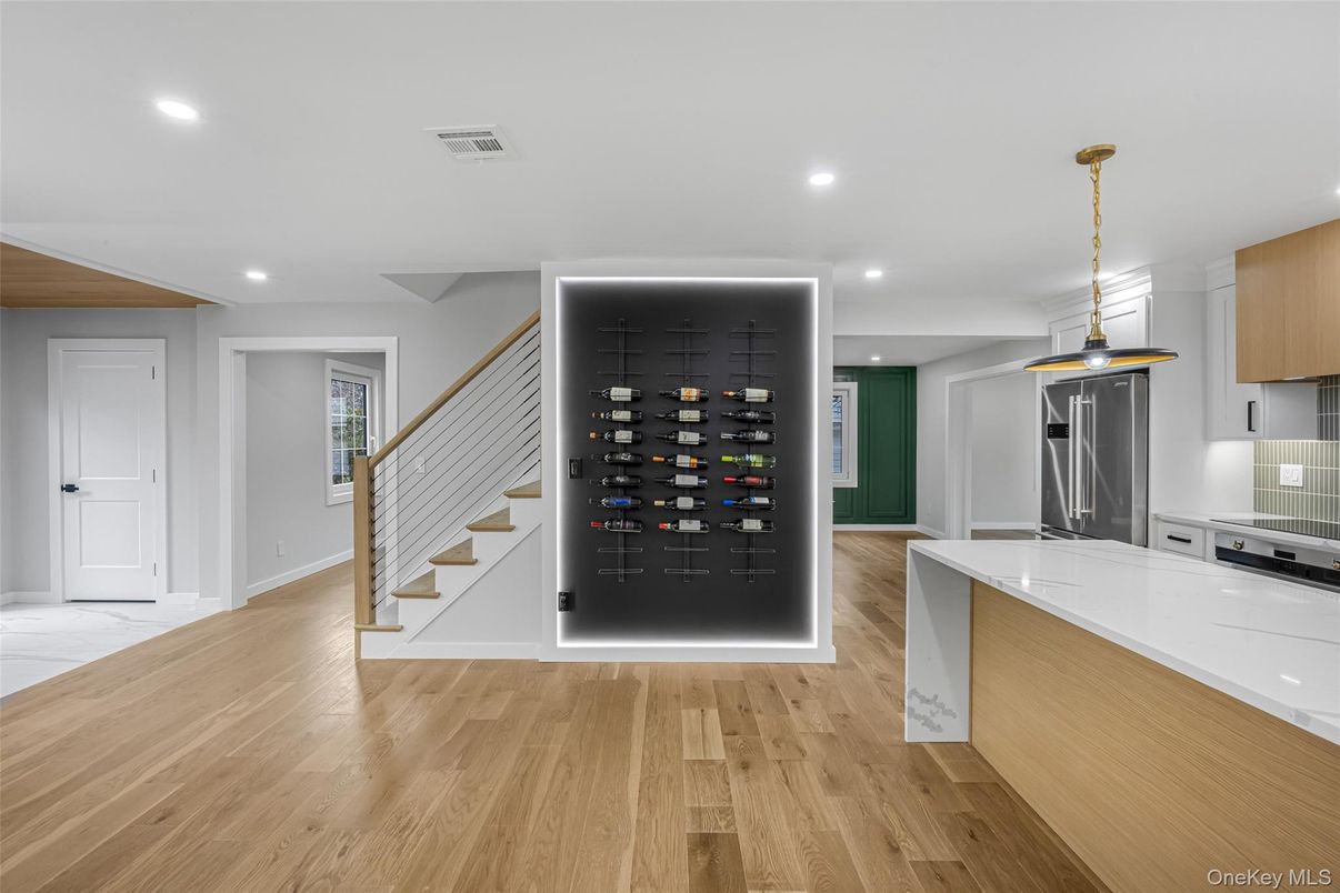 Interior, Kitchen, Pendant Lights, Recessed Lighting, Stainless Steel Appliances, Wine Storage, Wood Texture Flooring