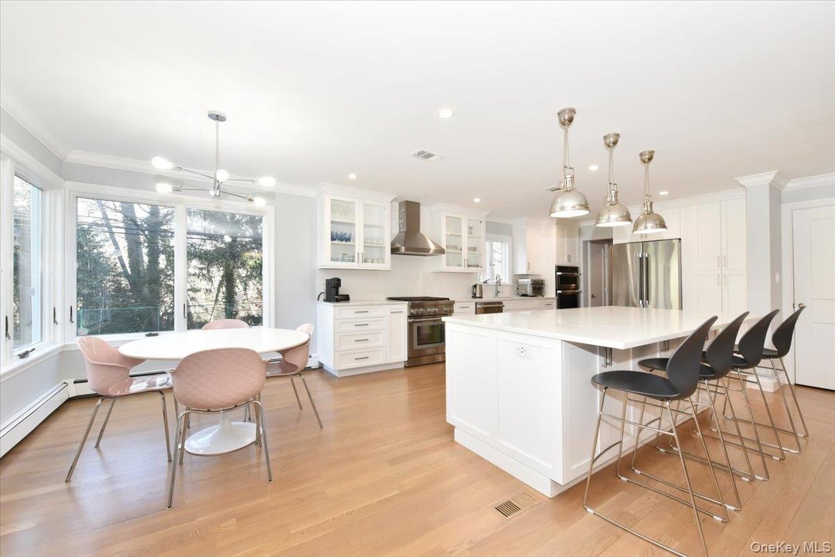Dining room, Interior, Kitchen, Pendant Lights, Recessed Lighting, Stainless Steel Appliances, Wood Texture Flooring