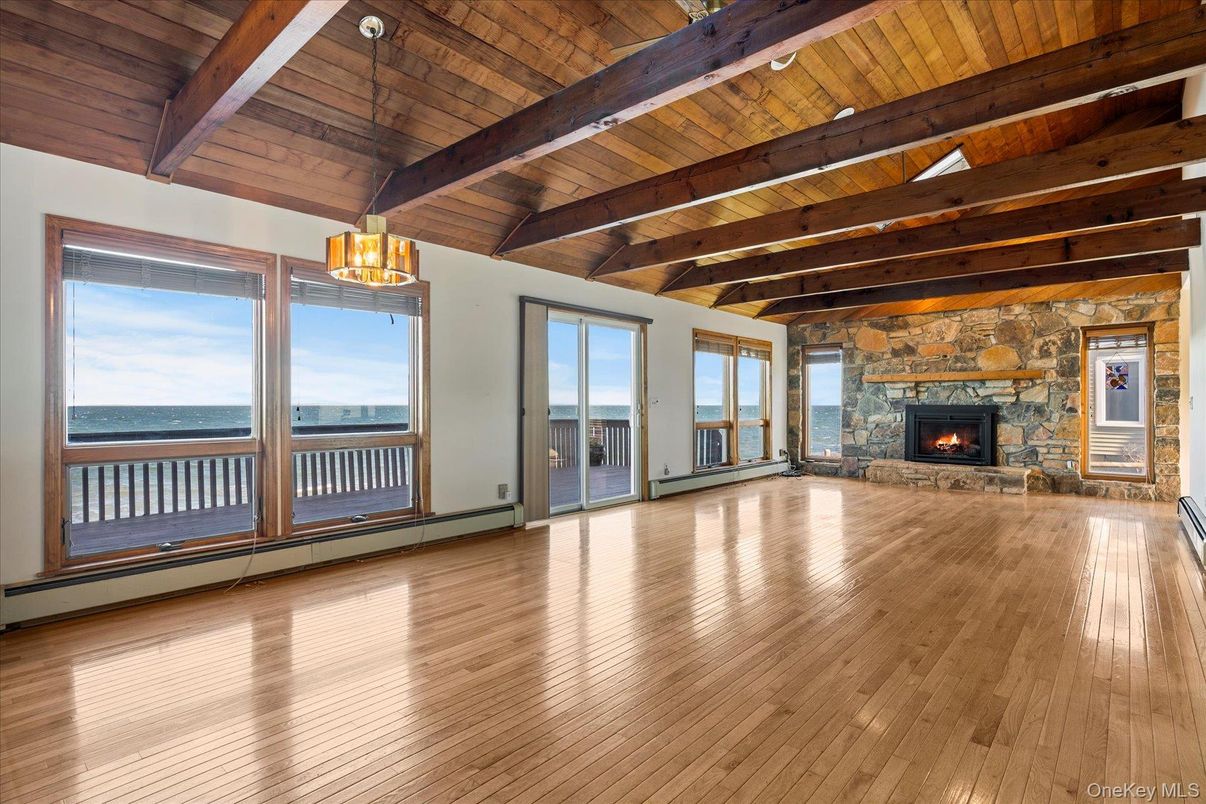 Empty room, Fireplace, Interior, Pendant Lights, Water, Wooden Beams, Wooden Ceilings, Wood Texture Flooring
