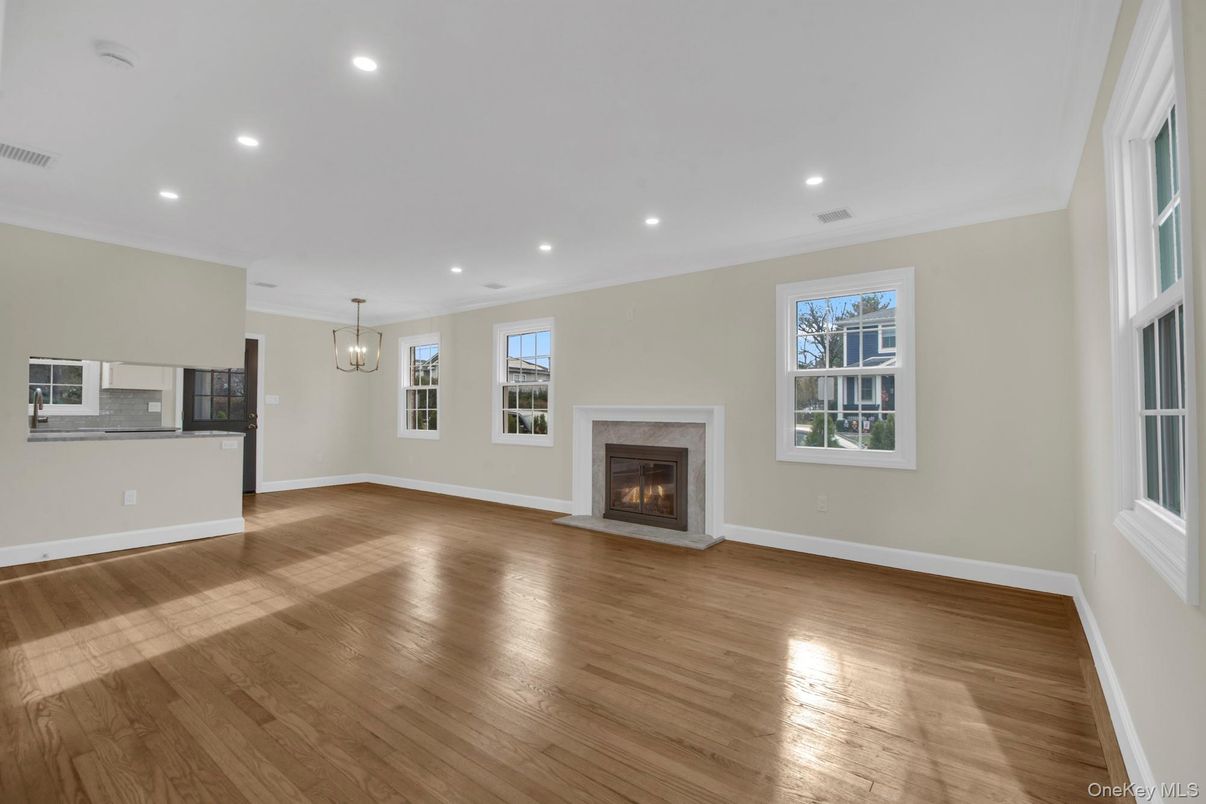 Empty room, Fireplace, Interior, Pendant Lights, Recessed Lighting, Wood Texture Flooring
